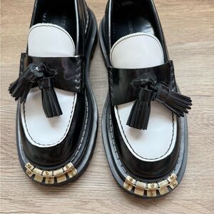 Black and White Tassel Loafers with Gold Accent
